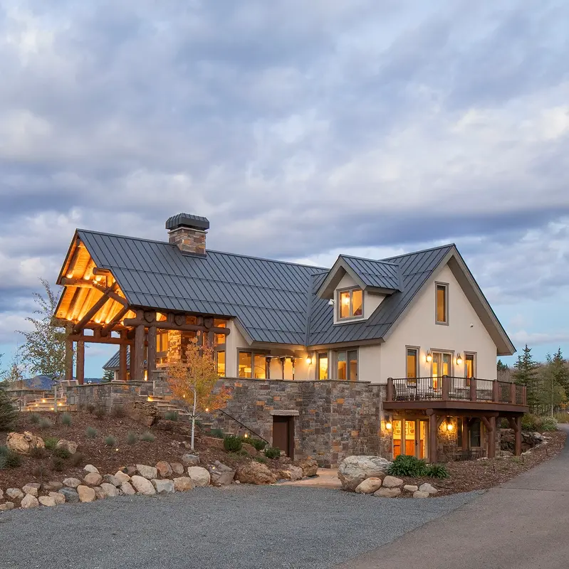 Renovated mountain home with modern dormers and timber porch, nestled in the hills above Crested Butte.