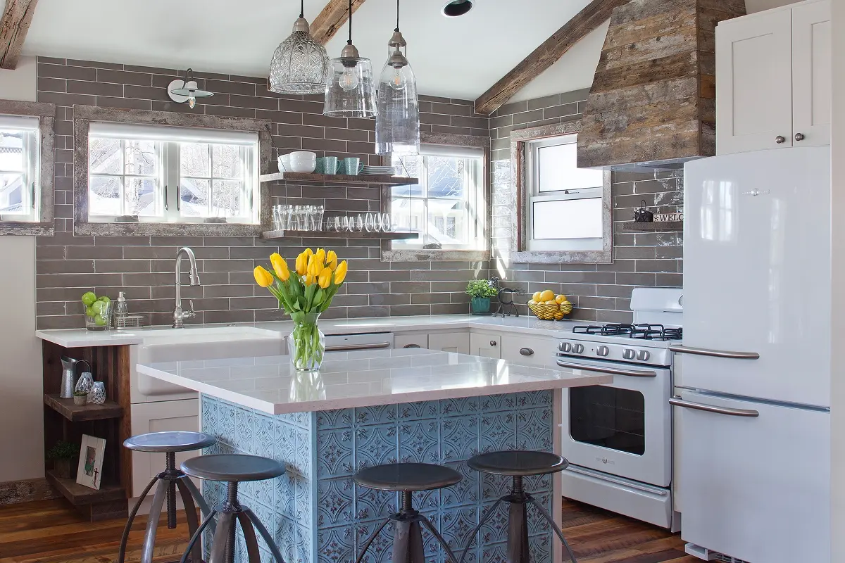 Cozy kitchen with vintage appliances, wood trim, and decorative island in Crested Butte.
