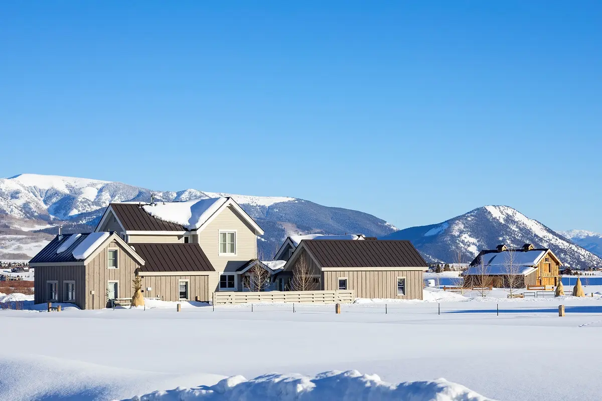 Mountain architecture barn complex blending into Crested Butte’s snowy alpine surroundings.