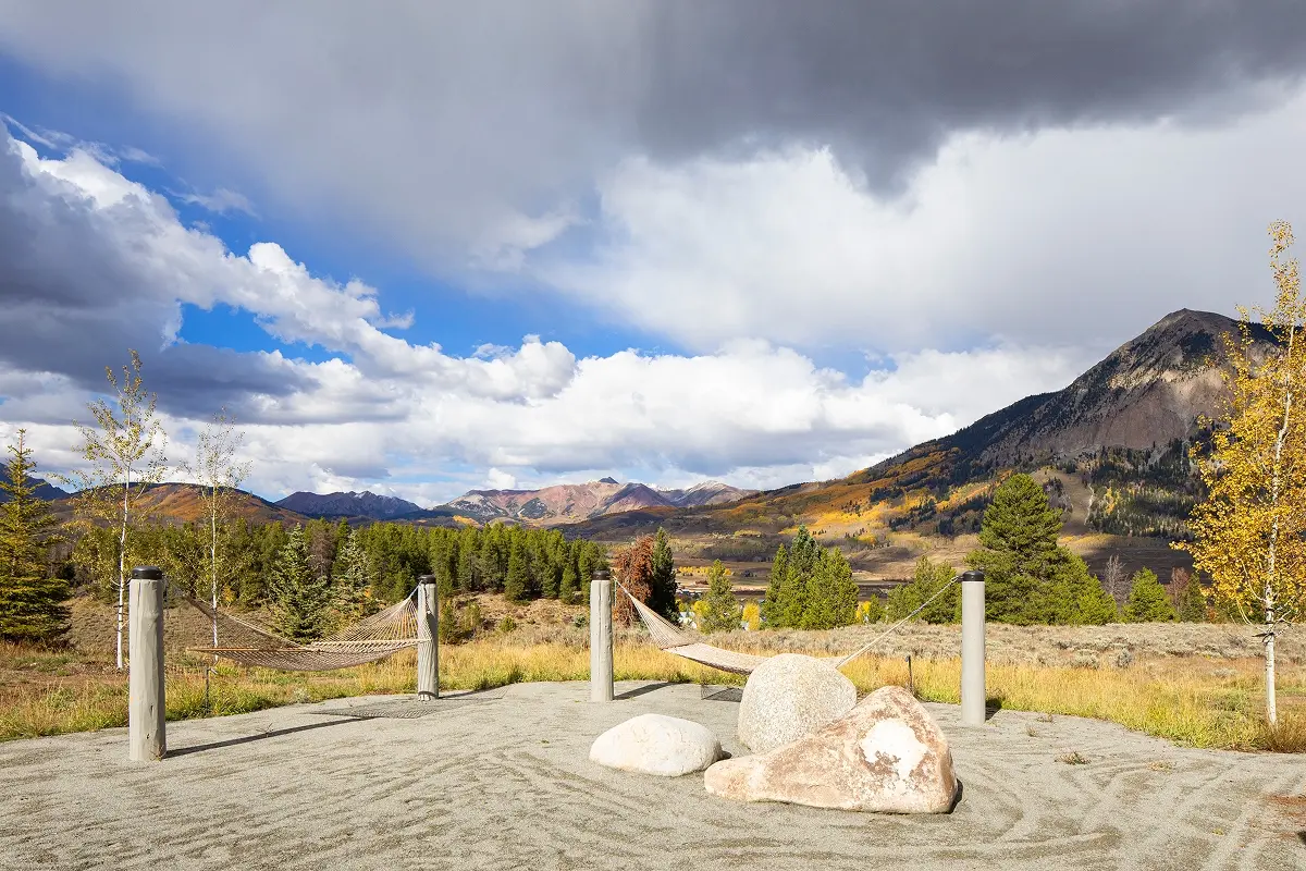 Relaxing hammock and sandy Zen garden space with expansive views of Mount Crested Butte and fall foliage.