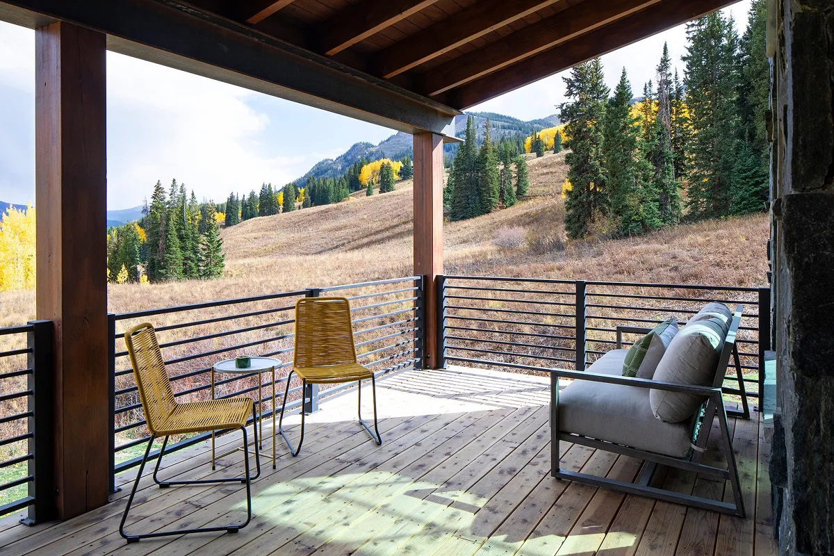 Private seating area on west-facing deck with views of East River Valley and pine-covered hills.