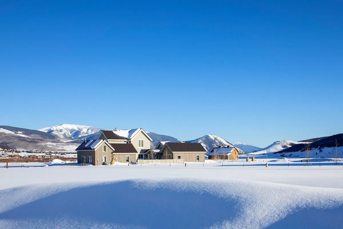 Snow-covered ranch-style barn project preserving local Crested Butte character and views.