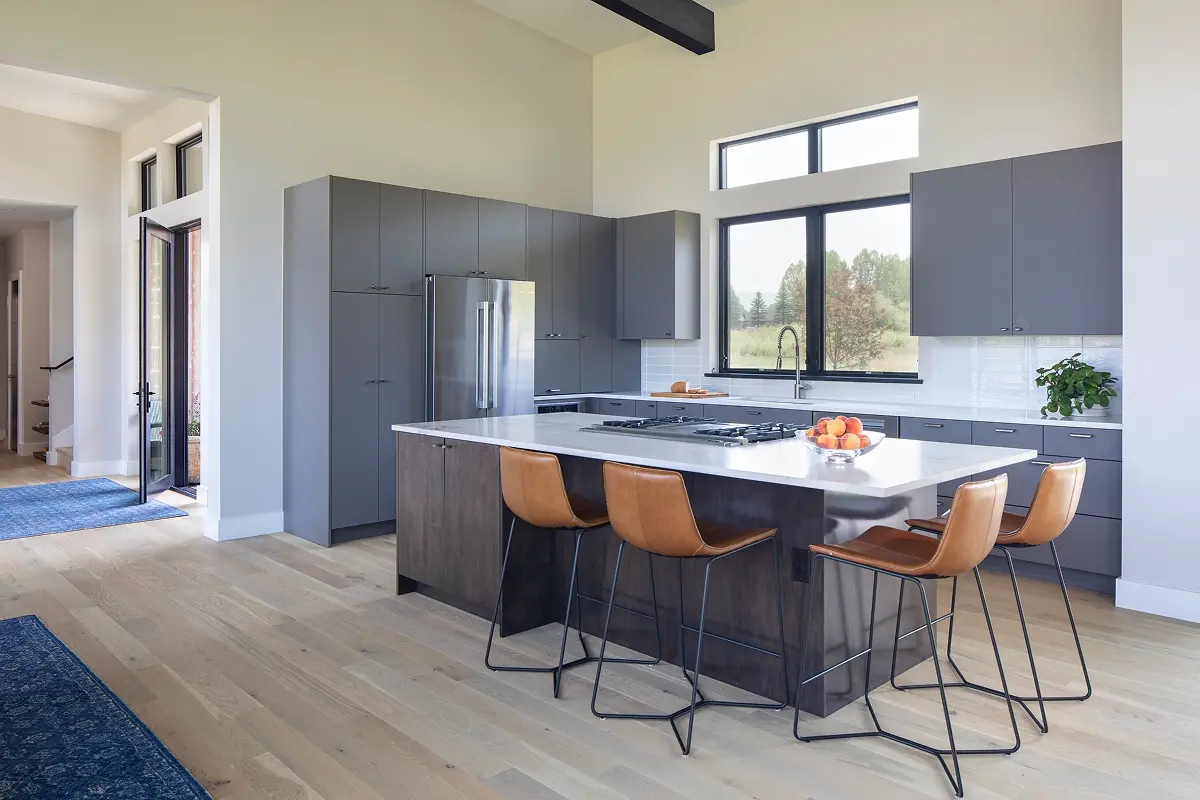 Modern kitchen with island and flat-panel cabinets designed by a leading mountain architect.