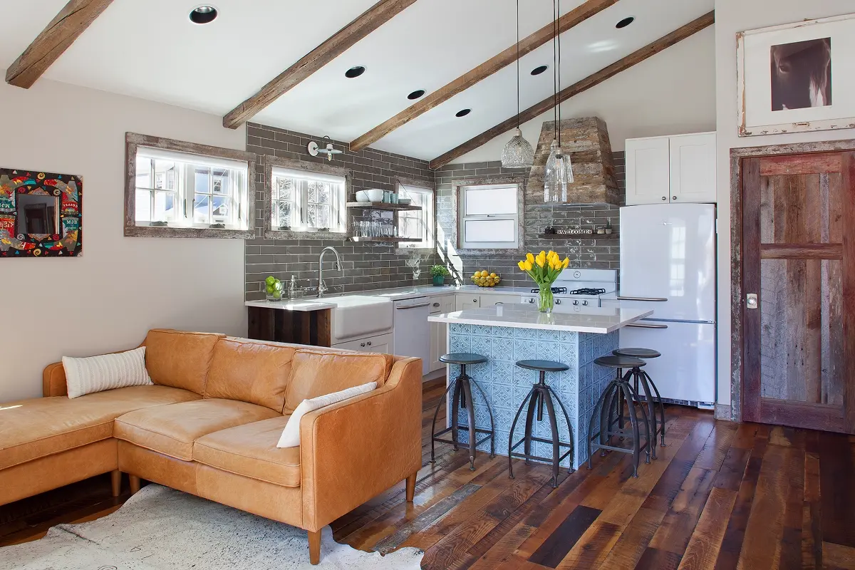 Open-concept layout with warm wood floors and rustic kitchen finishes in downtown Crested Butte.